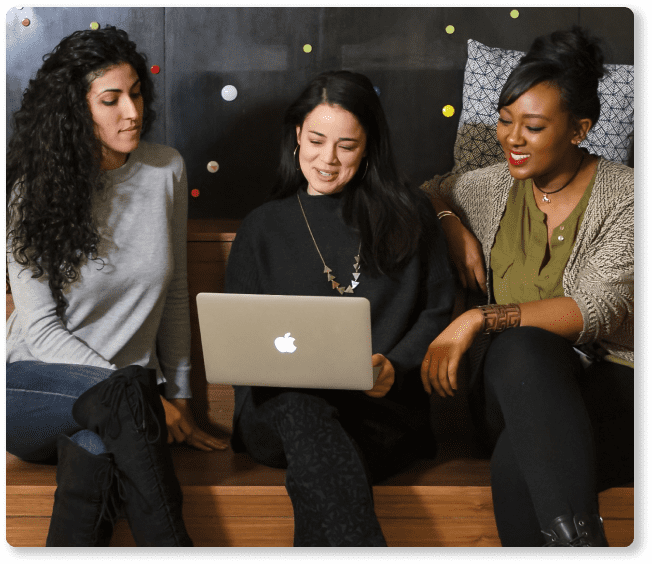 Team members collaborating in an office, representing hiredevs.ai and their developer hiring process.