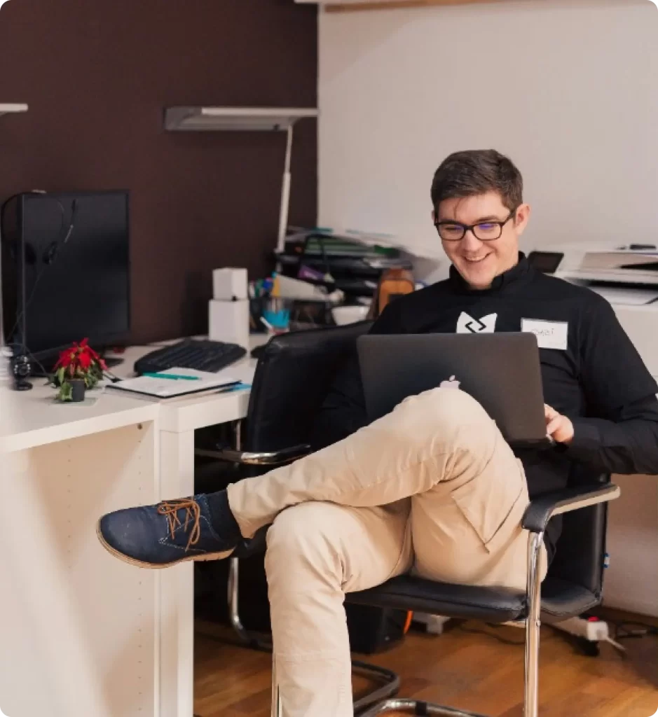 Team members collaborating in an office, representing hiredevs.ai and their developer hiring process.